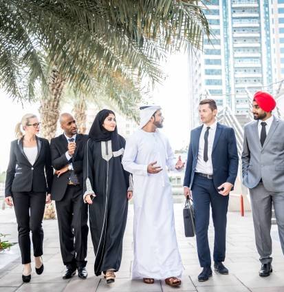 Business team in Dubai Multicultural business people meeting and talking about business - Multiracial business team meeting